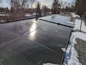 calgary solar panels with snow on a roof