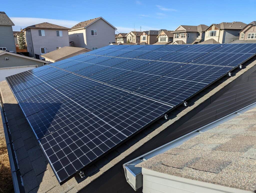 Are solar panels worth it in Calgary? Rooftop solar installation on a Calgary home with clear skies