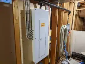 Electrical panel on a stud framed wall in Calgary