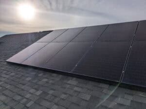 Solar panels Chestermere roof with the sun low in the sky