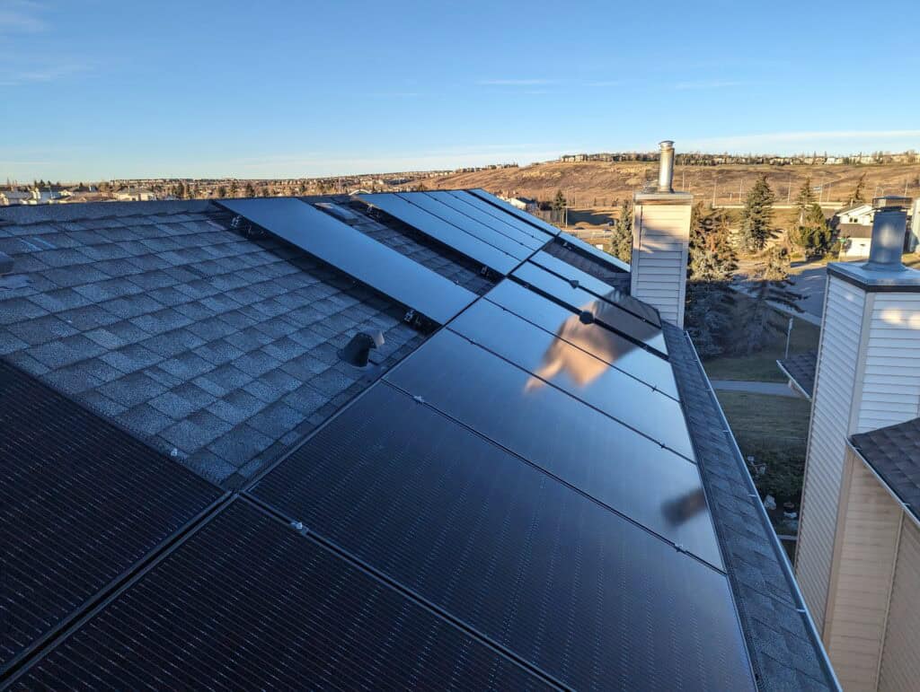 solar panels in cochrane with hills in the background