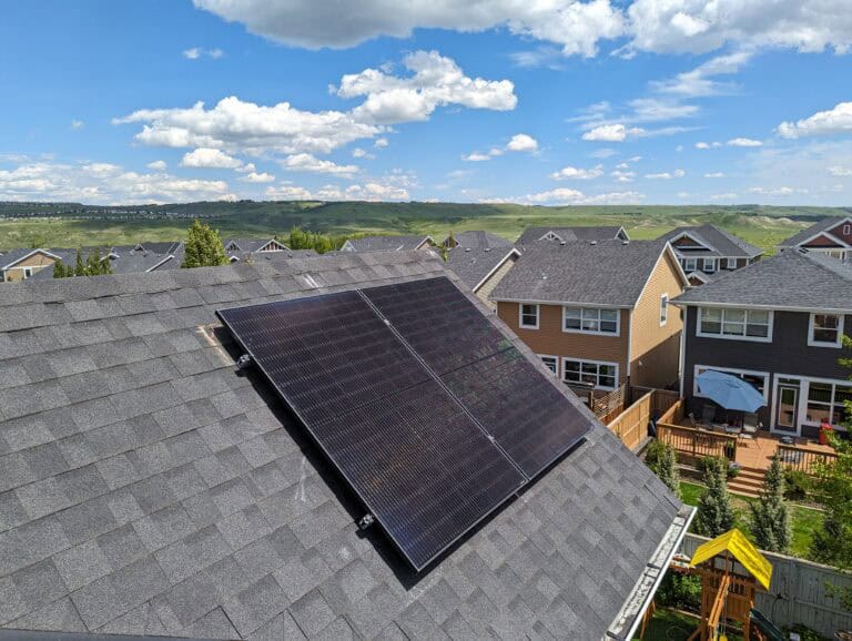 two solar panels on a roof in Cochrane, Alberta