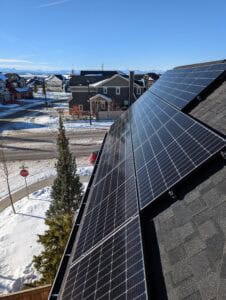 solar panels in cochrane of a high roof with a view of the mountains