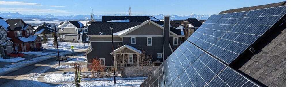 View of the mountains from a solar panels Cochrane, Alberta installation