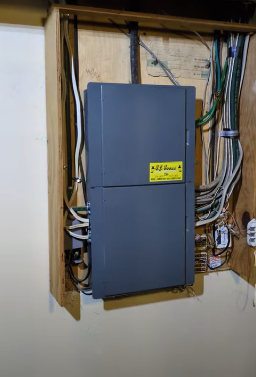 Before of a 100 to 200 amp electrical panel upgrade in Calgary