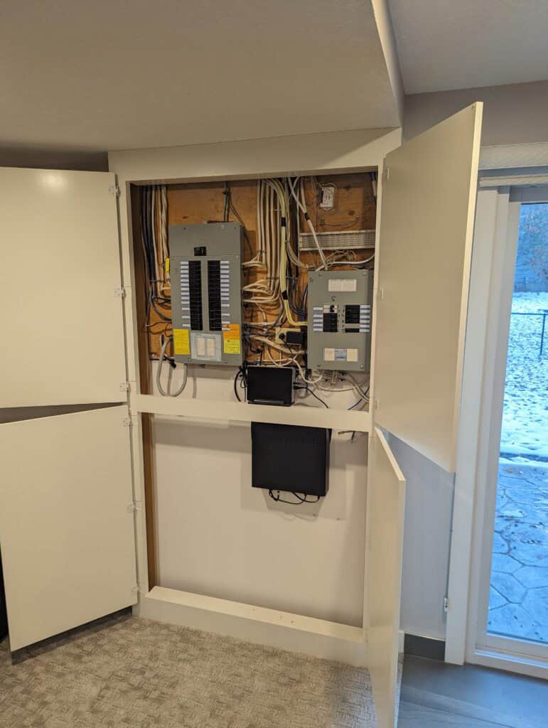 Licensed Calgary electrician installing a sub-panel for a basement suite