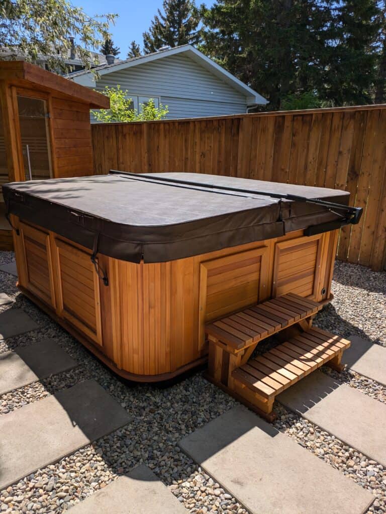 Hot tub electrical disconnect box installed in a Calgary backyard