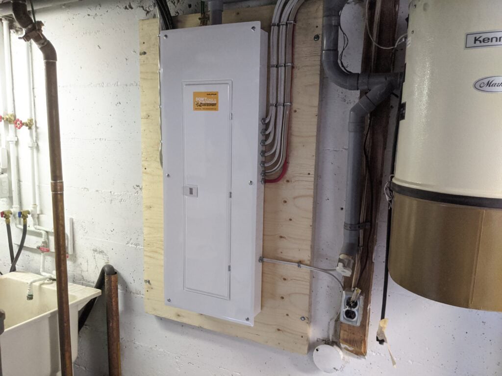 Calgary electrician assessing panel busbar capacity for solar installation